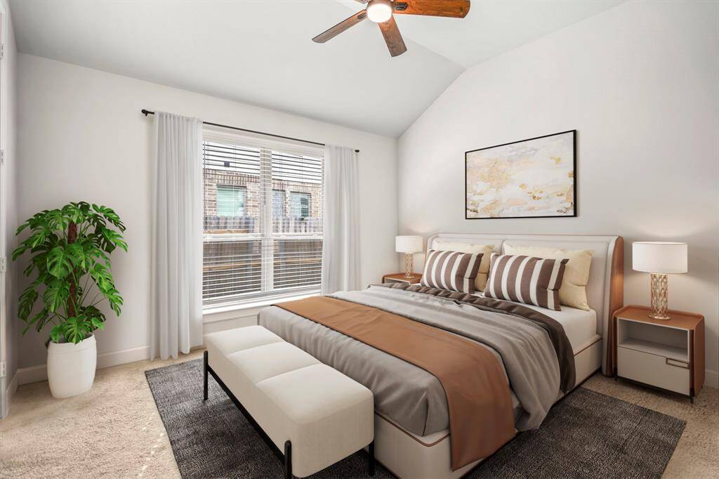 First of the spacous secondary bedrooms, with an ensuite jack and jill bathroom, featuring plush carpet, above ceiling fan, and bright natural light! *This room has been virtually staged