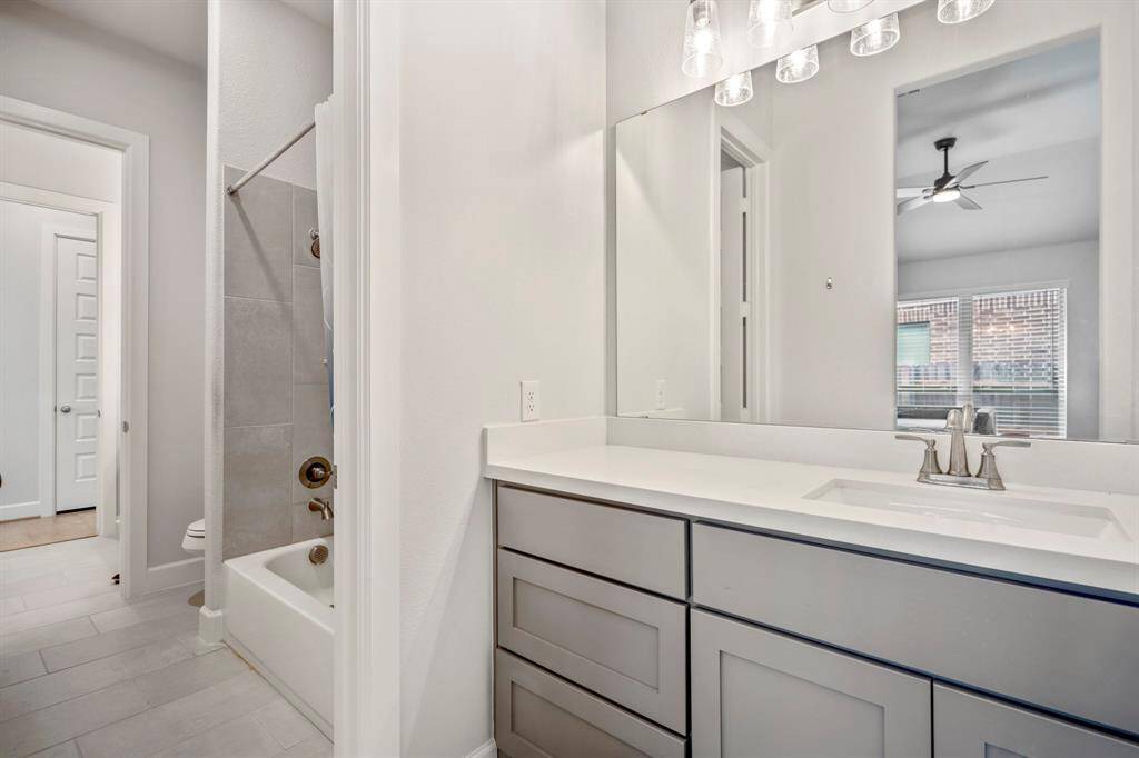 Convenience meets style in this Jack and Jill bathroom! Featuring a shared tub/shower combo and private access from two bedrooms, this thoughtfully designed space makes mornings easier while offering plenty of storage and functionality. Perfect for siblings or guests!