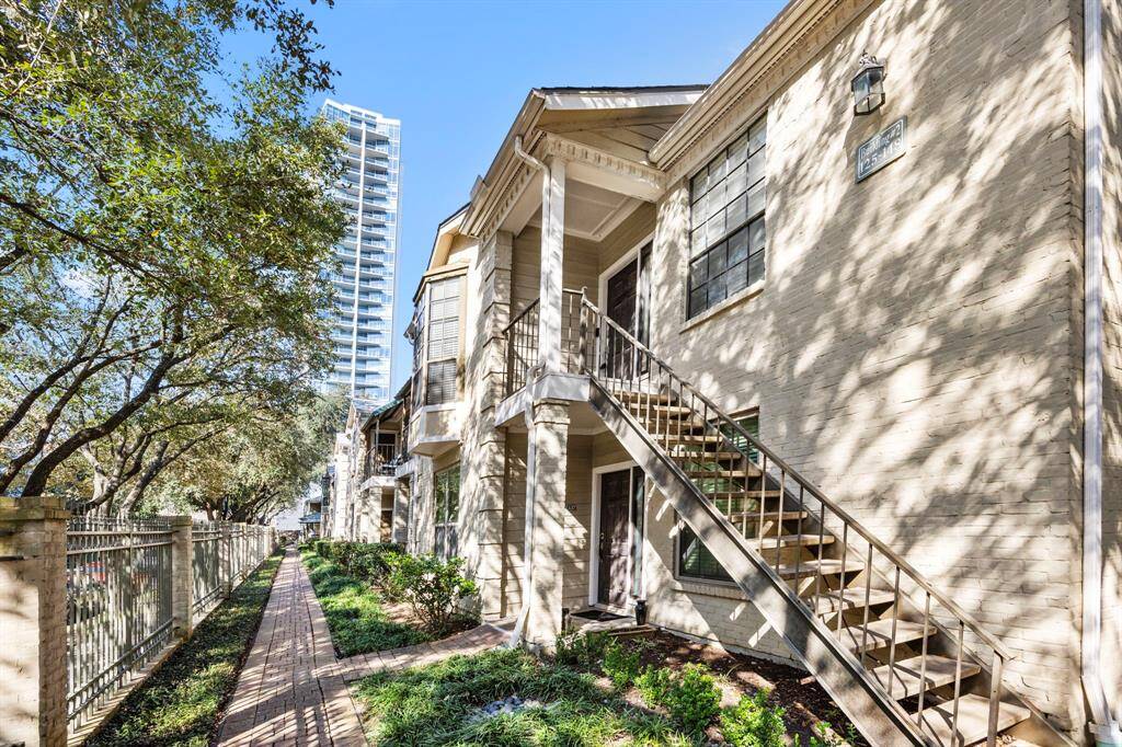 This charming upstairs corner condo offers a perfect blend of modern convenience and classic appeal, nestled in a prime location with tree-lined walkways and easy access to urban amenities.