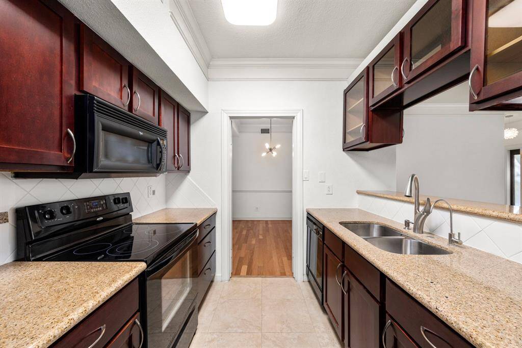 Another view of the kitchen, leads out to the dining room.
