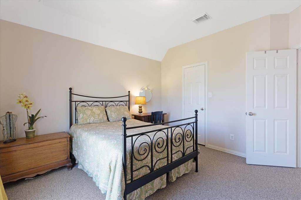 Secondary bedroom number two also faces the front yard.