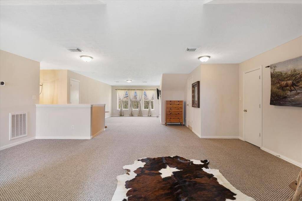 Large game room located upstairs.