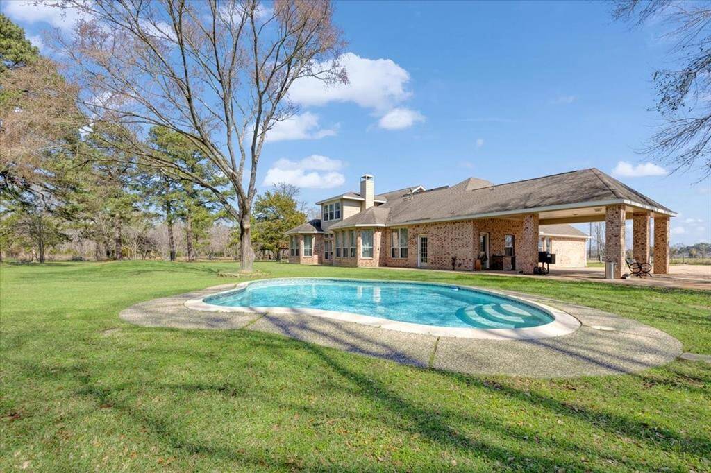 There is covered parking for two cards and property has a beautiful in-ground pool.