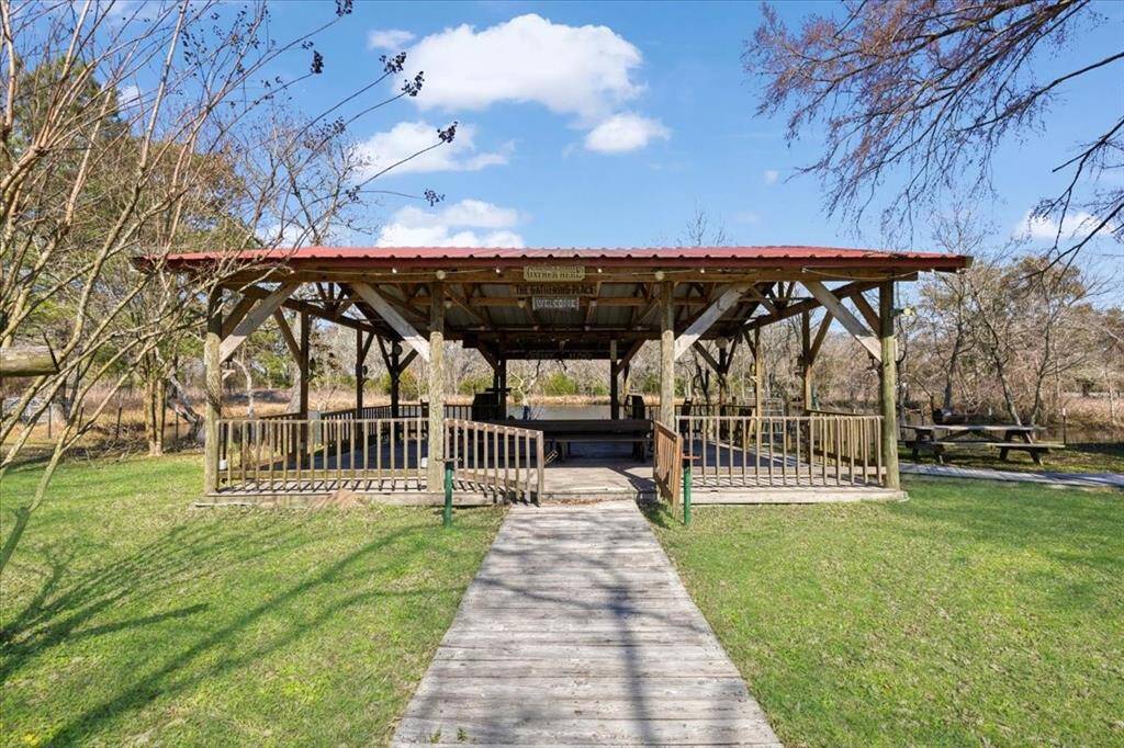The gated gazebo at the ponds edge is great for shade while hanging out at the water.