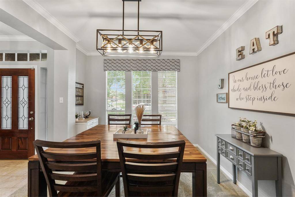 Contemporary fixtures are a perfect accent to create a modern farmhouse style. Notice the recessed wall near the window ready for a buffet or wine rack. This photo is staged for photo purpose.