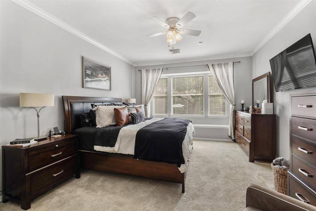 Trimmed with Crown molding and bathed in cool tones, this room exudes beauty and relaxation. This photo is staged for photo purpose.