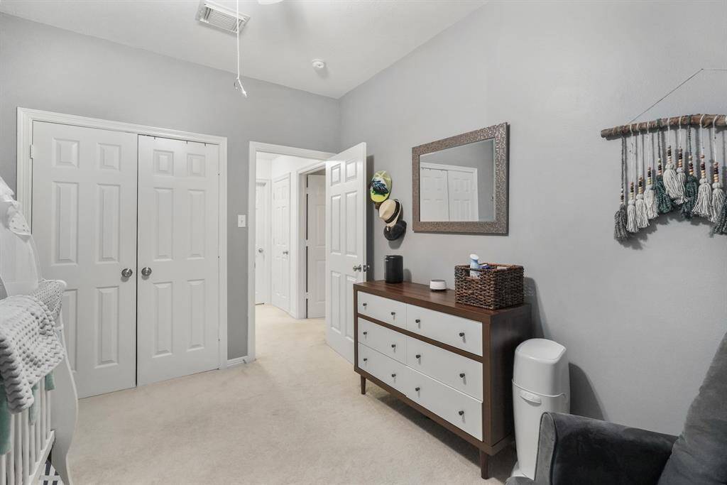 Another view of Bedroom 3 shows a sizable closet near the door. This photo is staged for photo purpose.