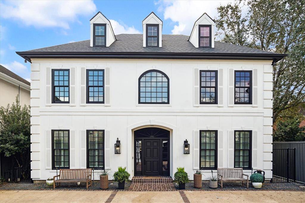 Welcome to the timeless elegance of 2921 Cason Street, a stunning two-story French-inspired residence. Boasting a crisp white façade accented by stylish lanterns, classic shutters, and large windows, this home effortlessly combines modern sophistication with traditional charm.