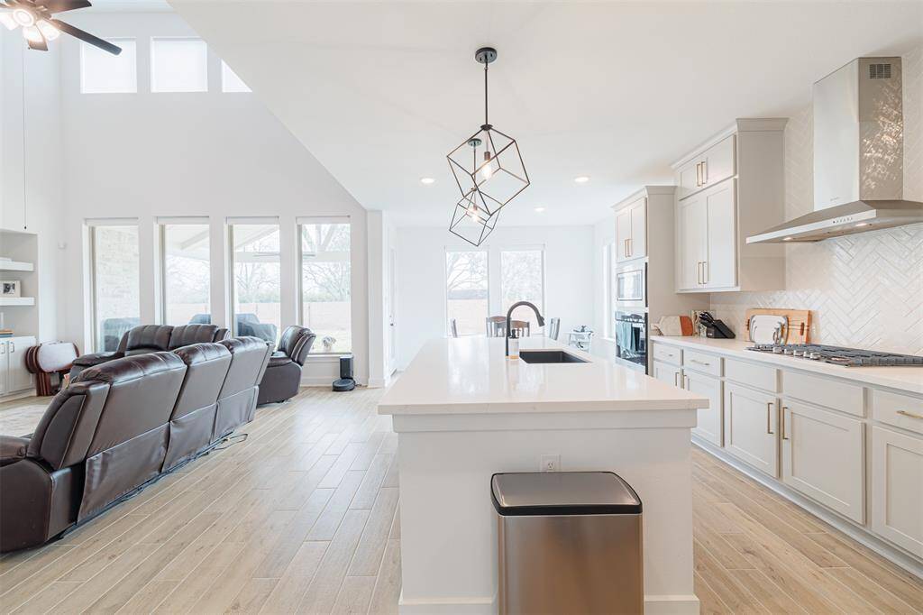 Island kitchen is open to the family room.
