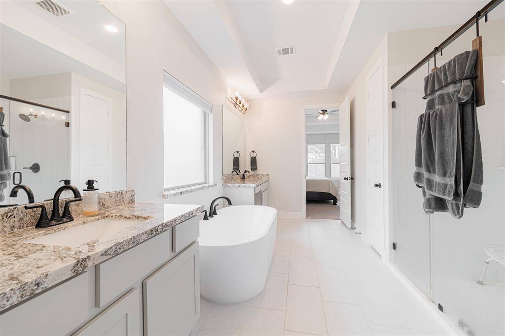 Another view of the primary ensuite bath looking towards the primary bedroom.