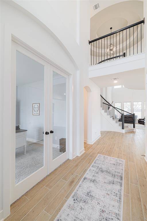 2-stry entry leads to the study with double glass doors.