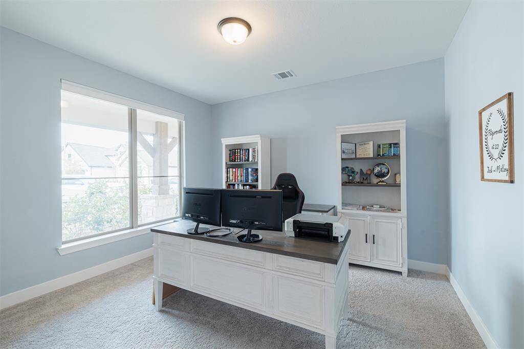 Private study with double glass doors.