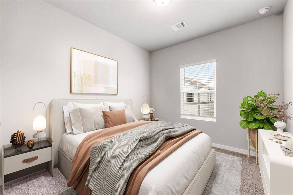 Secondary bedroom features plush carpet, custom paint, and a large window with plenty of natural light. •Virtually Staged