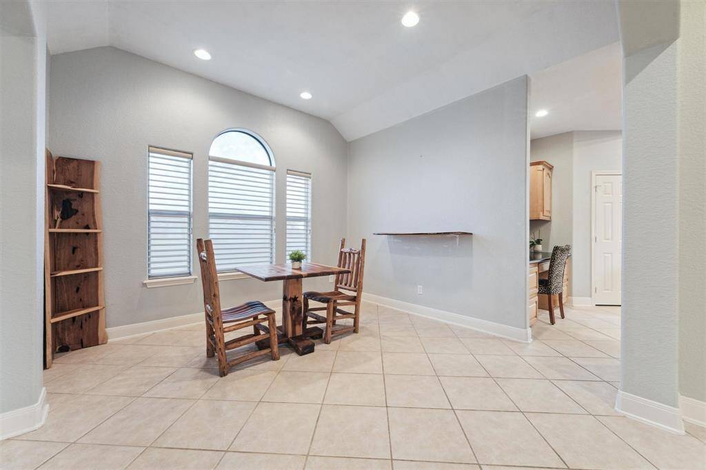 The formal dining room opens onto the kitchen and the living room.
