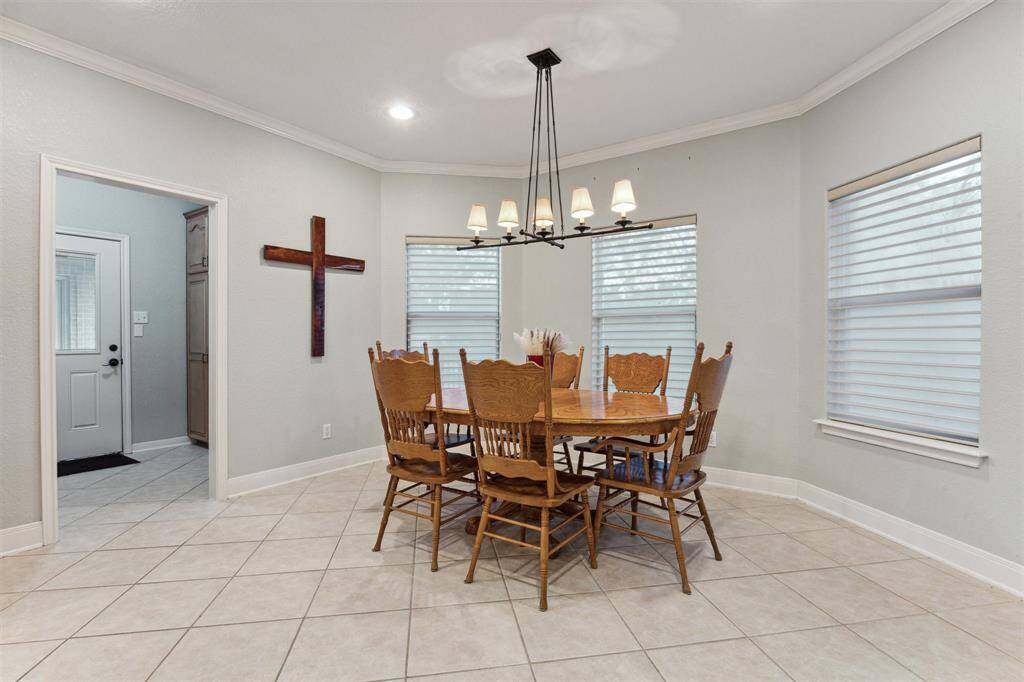 The breakfast room can accomodate a large table and opens to the powder room and mud room.