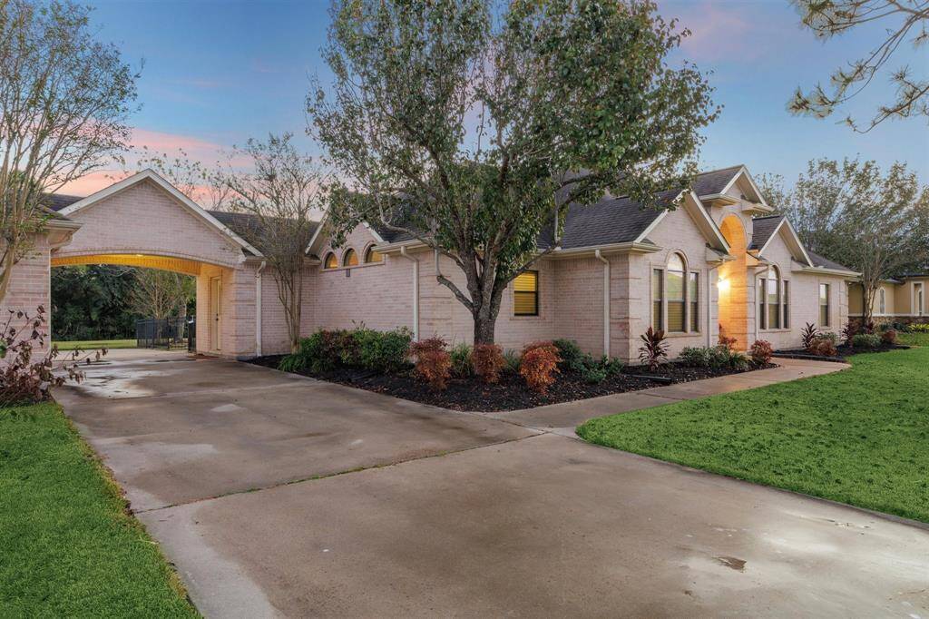 The landscaping highlights the home. A sprinkler system helps maintain the beauty especially in those hot summer months.