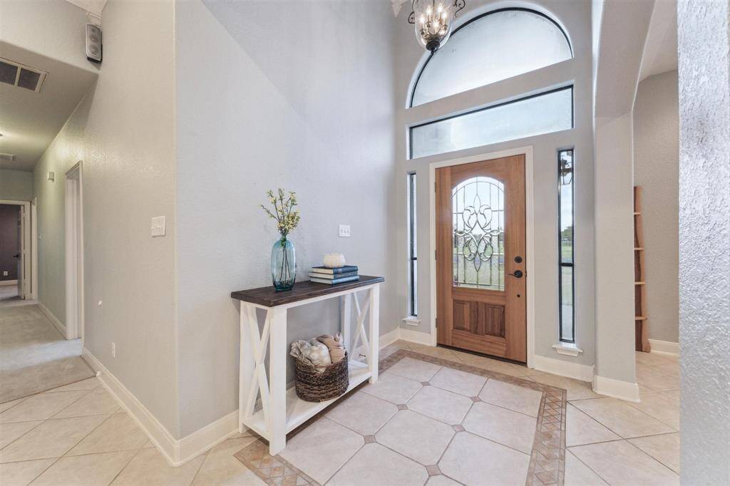 Step inside to an entryway that opens onto the large living room and dining room areas.