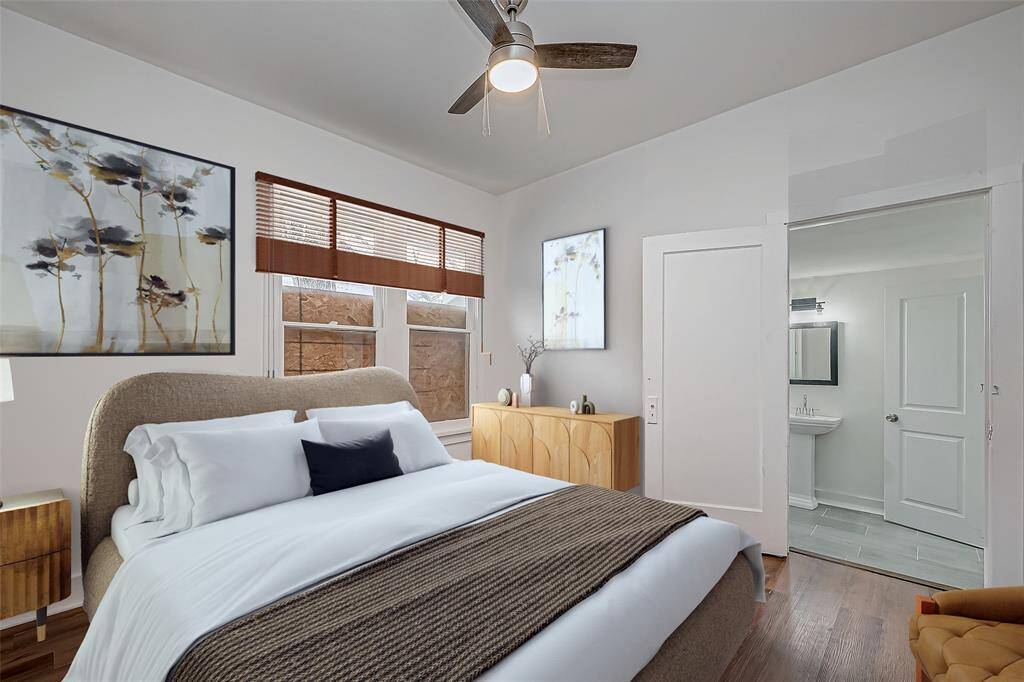 This virtual staging highlights the generous size of this bedroom–easily accommodating a bed, a nightstand, and additional furnishings. The large window allows for natural light, enhancing the calming and airy feel of the room while leaving room for personalization.