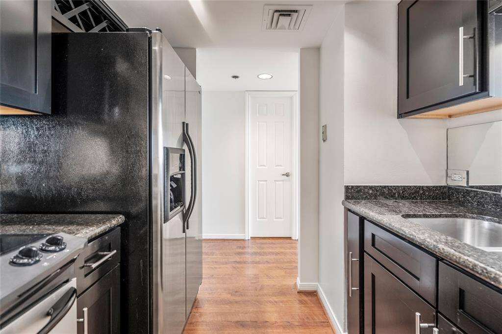 The kitchen comes with the refrigerator.