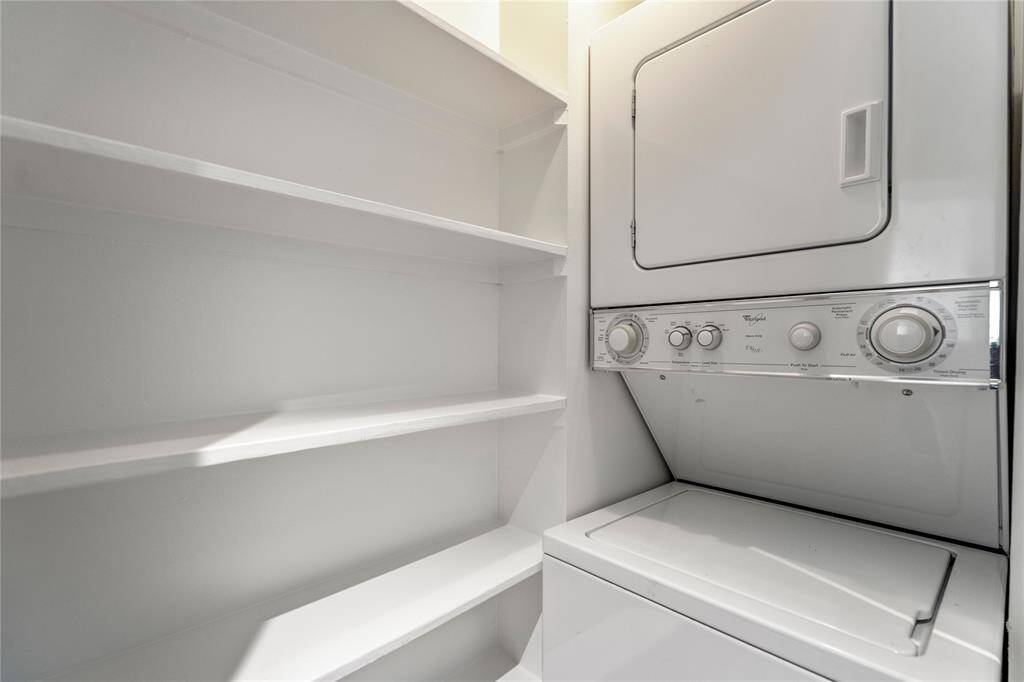 The stacked washer and dryer come with the unitq