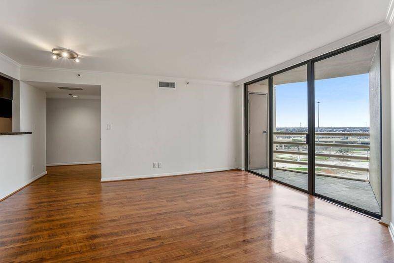 The living room with floor to ceiling windows for an open and light feeling.