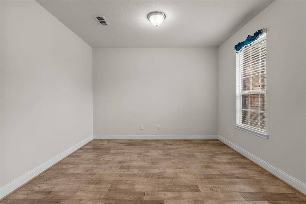 Spacious Home Office: A serene and private space with ample natural light, perfect for productivity and creativity.