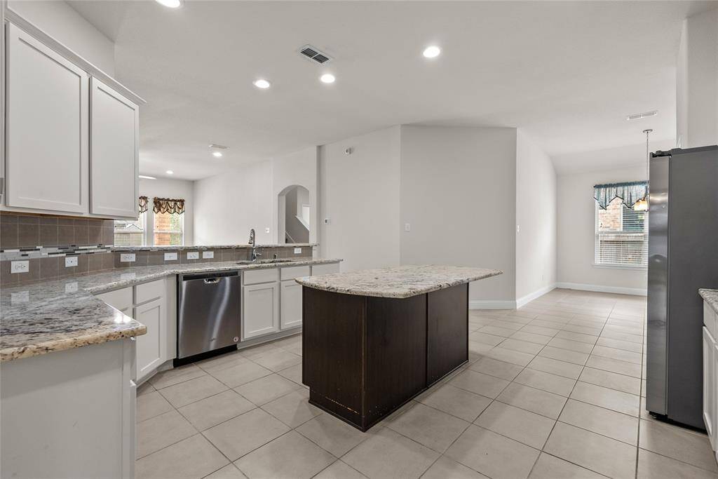 This very large kitchen has a huge kitchenette area