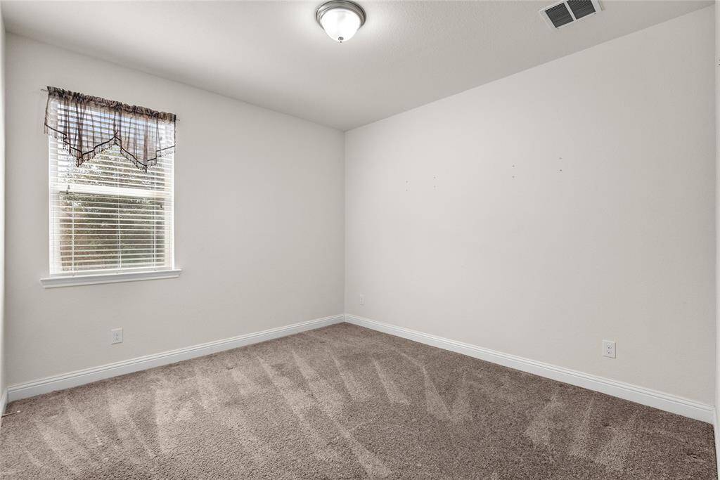 This is a bright third  downstairs bedroom.
