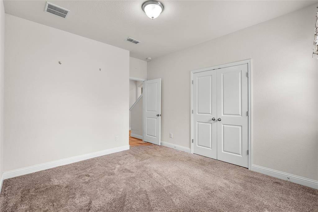 Another view of the third downstairs bedroom of the gorgeous home