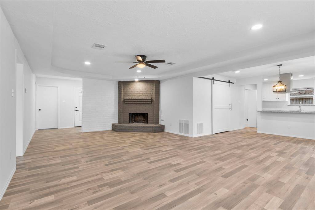 The Family Room opens up to the Dining and Kitchen area creating a hard to find open floor plan concept in established areas.