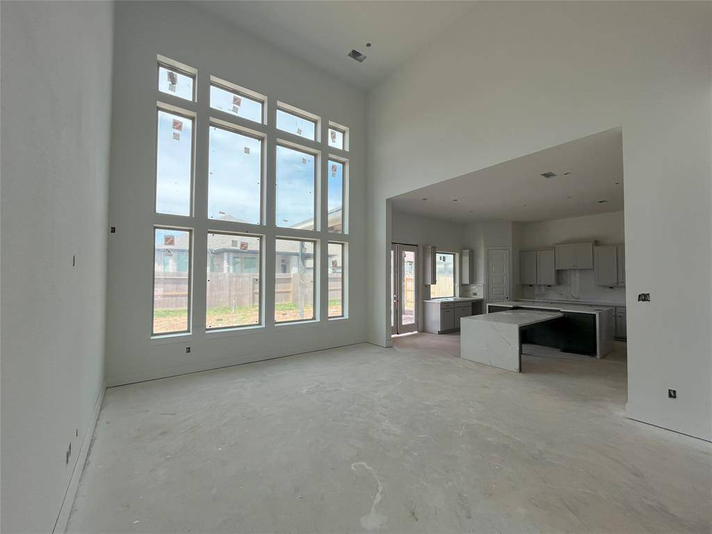Family room features a wll of windows.