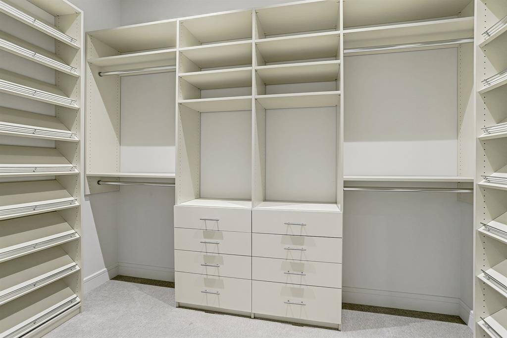 Amazing closet with custom built-ins - ready for your belongings!