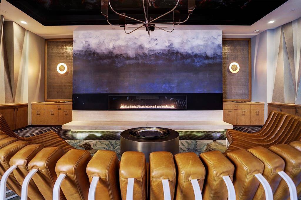 The building has numerous spaces for entertaining such as this media room.