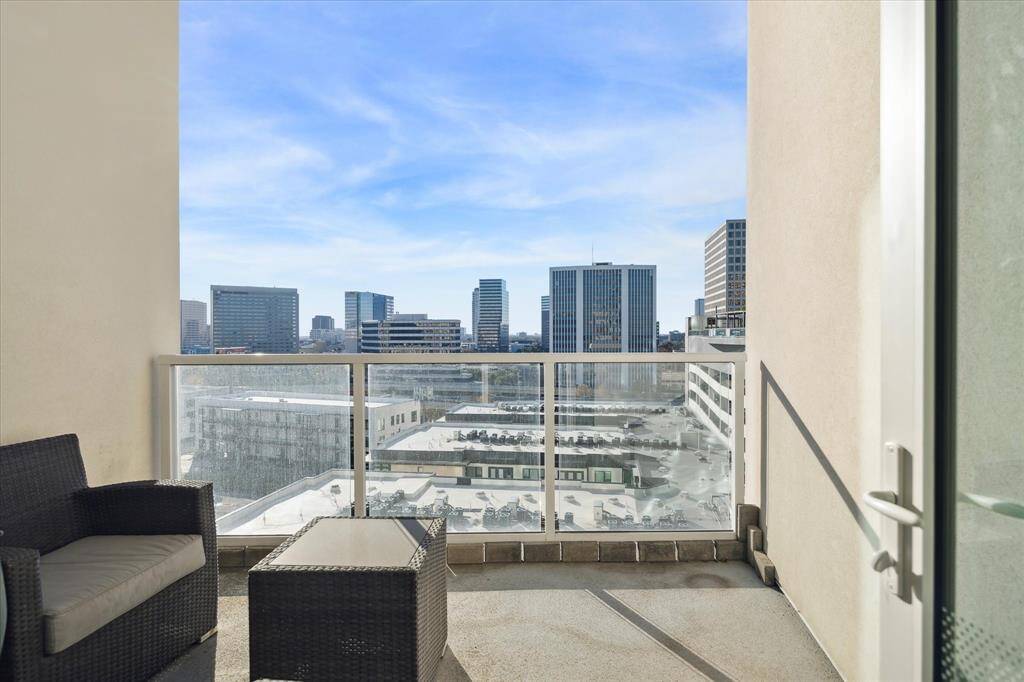 The balcony is a perfect place to get some fresh air and take in the scenes of the city.