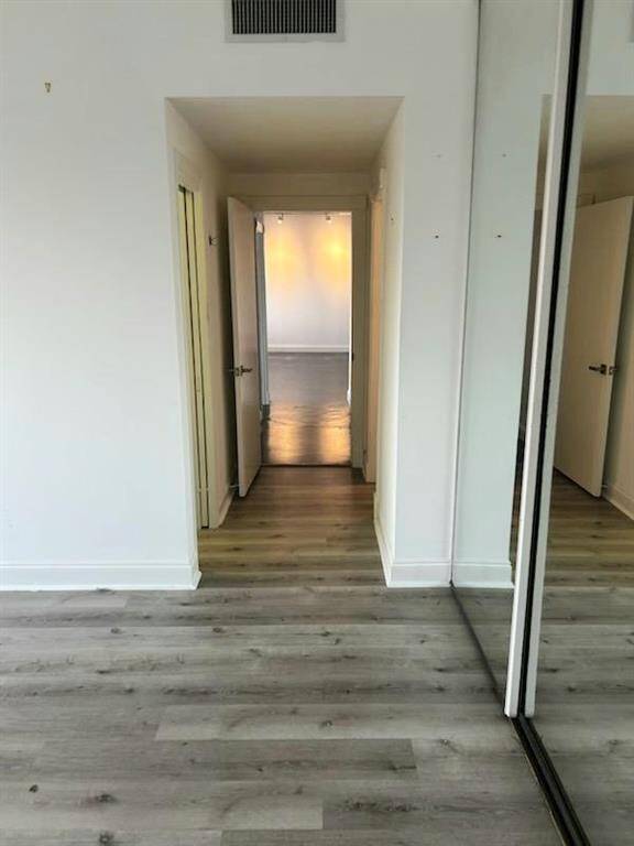 LOOKING FROM PRIMARY BDRM BACK DOWN HALL