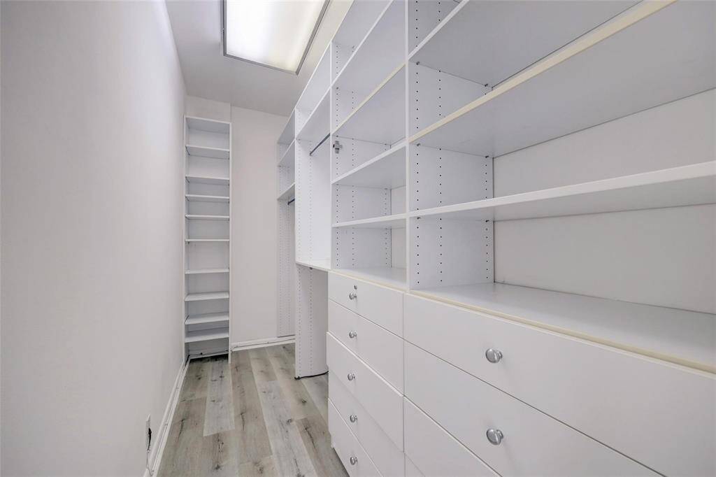 WONDERFUL CLOSET  WITH GENEROUS BUILT INS, SHELVING AND HANGING CLOTHES.