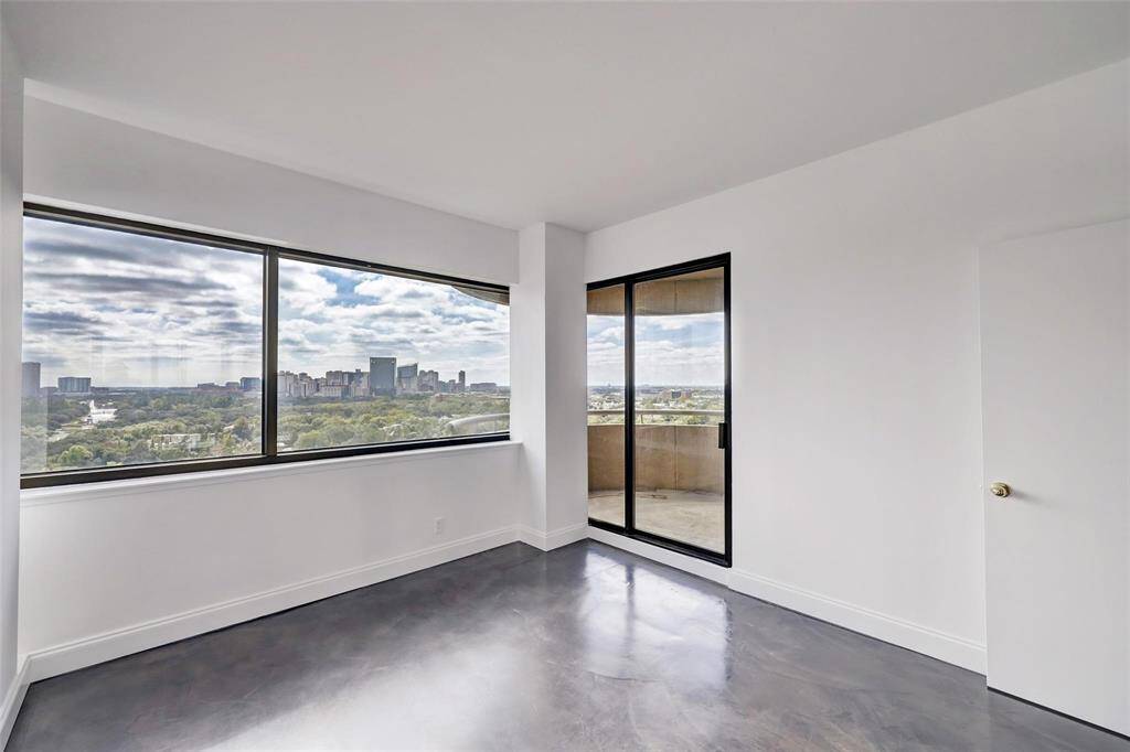SECONDARY BEDROOM WITH ACCESS TO THE  SCENIC BALCONY WITH UNOBSTRUCTED VIEWS TO THE SOUTH.