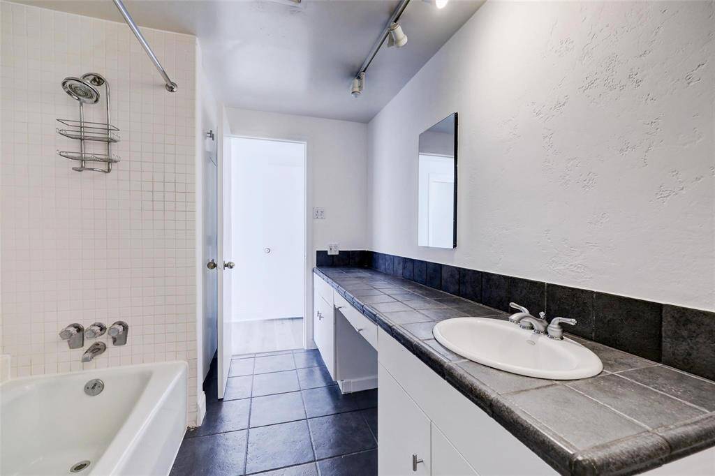 ONE OF 2 LARGE BATHROOMS, DUAL VANITY, AND TUB SHOWER COMBO