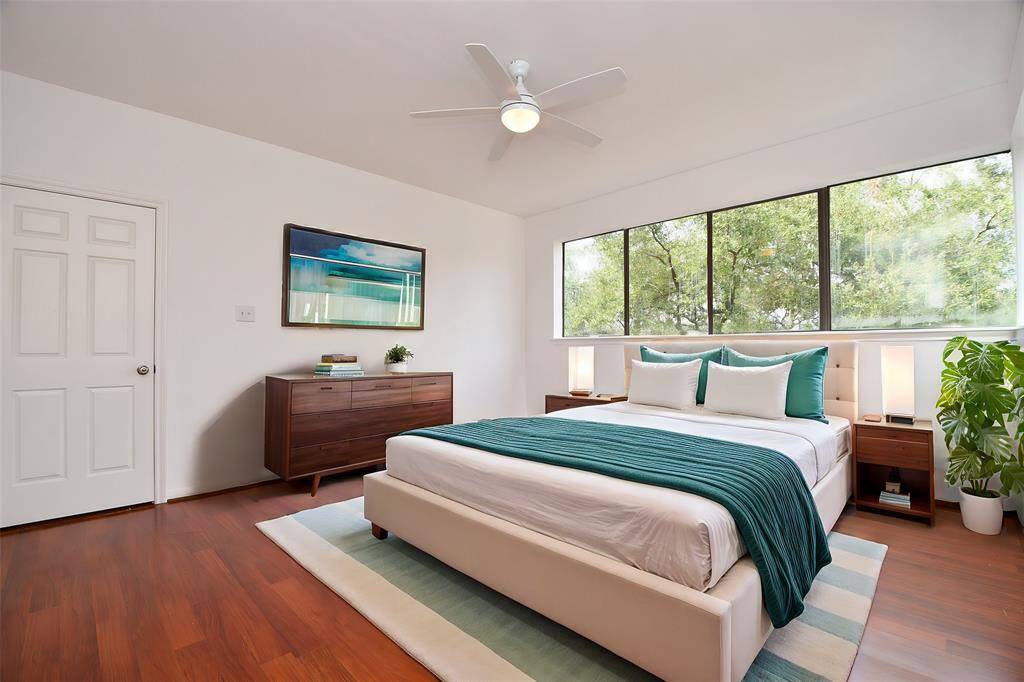 A wall of large, higher placed windows in your primary suite offers more room for your special furnishings and accents. Virtually Staged.