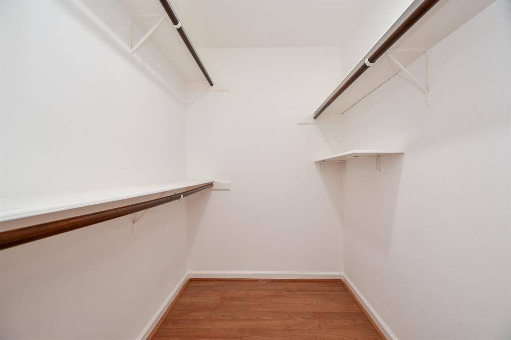 This amazing primary walk-in closet will easily store just about everything you own in one place!