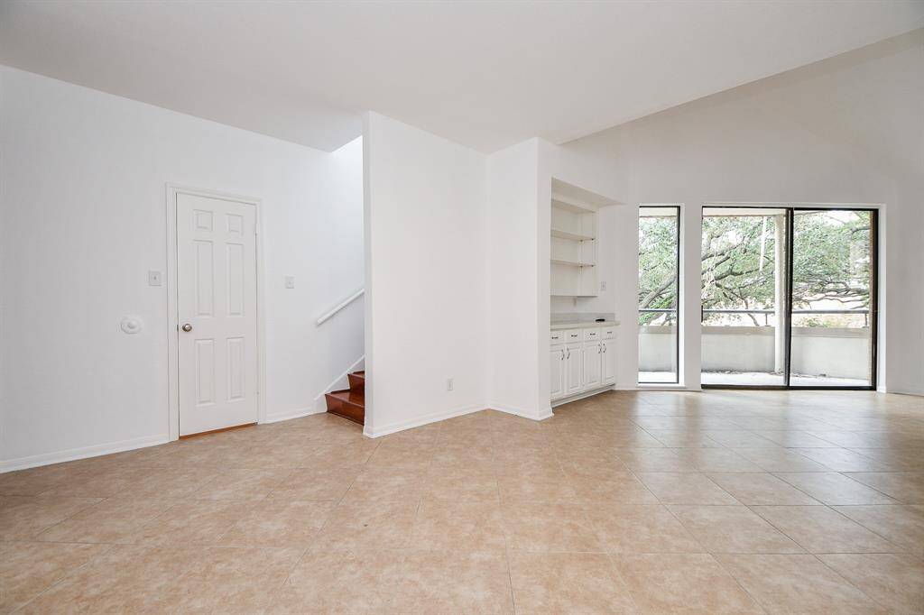 It's the clever and useful details of this condo that resonate with new owners; such as the generous built-in shelving/cabinet wall piece, perfectly placed for everyday and special day entertaining.