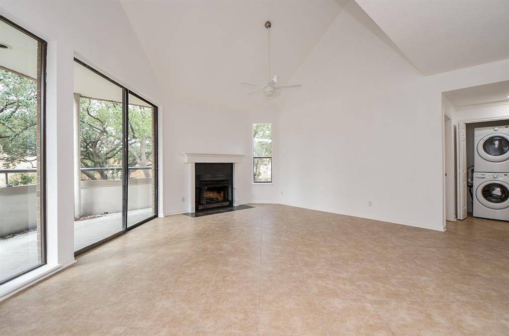 Imagine this naturally lit room filled with family and friends, especially at holiday time, while a warm glow emanates from the cozy corner fireplace. Also, note the handy utility closet, right.
