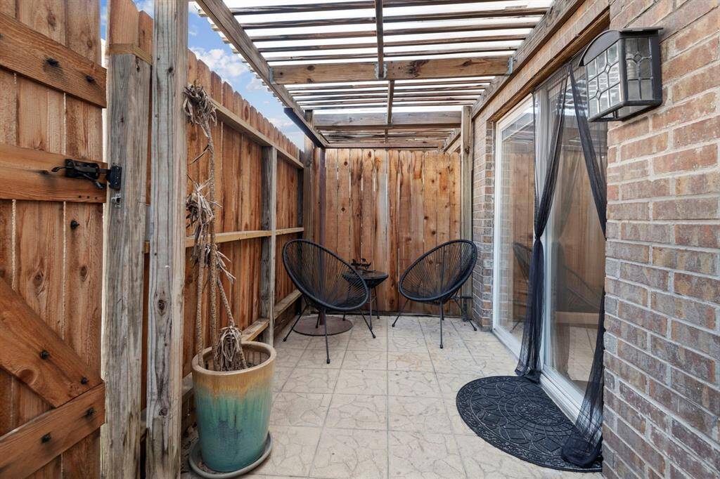 This private covered and fenced in porch area is the perfect place to grab a cup of coffee and relax.