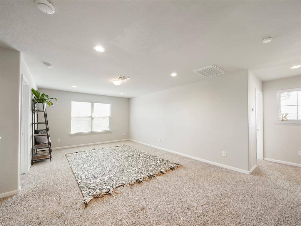 This large and versatile space is perfect for a second living area, playroom, or media room. With plenty of natural light and recessed lighting, this open-concept game room is ready for entertaining, relaxing, or family fun!
