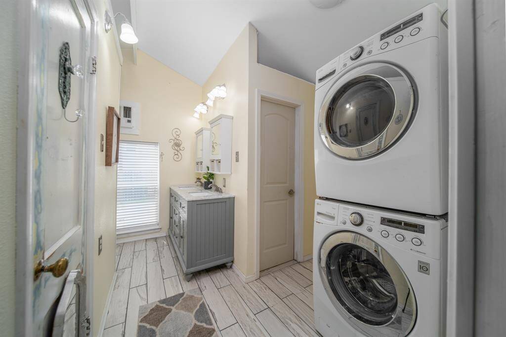 Bathroom 2 joins the laundry room which features a stackable washer and dryer.