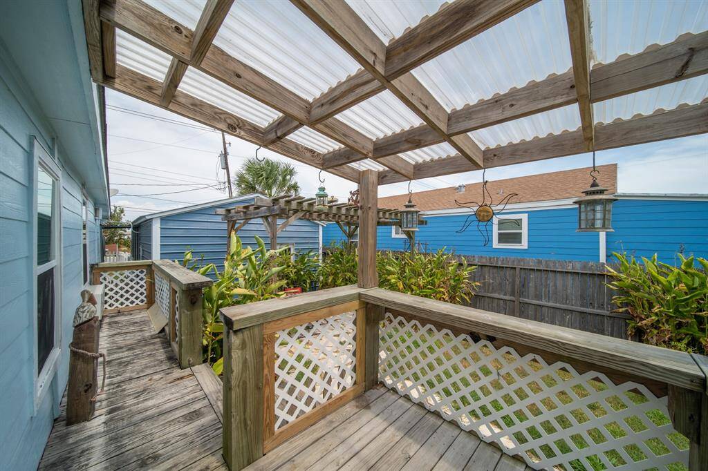 Looking out from he covered deck, you'll notice a pergola in the background.