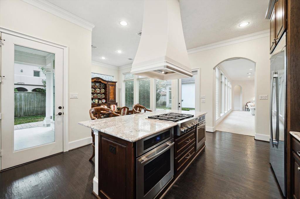 Outstanding is the large center island in the KITCHEN (20 X 12) with its granite counter, Breakfast Bar seating, 2 stainless Jenn Air ovens, stainless Jenn Air 6 burner cooktop, stainless Fiber Hood with white surround!