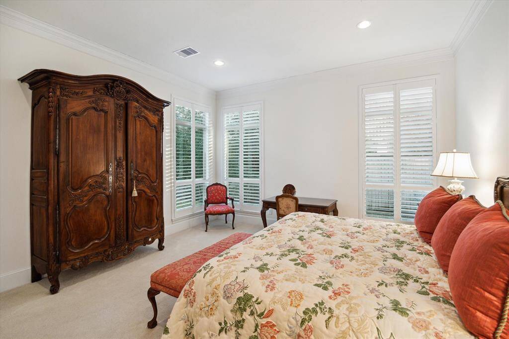 Closer view of the Primary Bedroom showing the three oversized windows which allow an abundance of light to enter the tranquil retreat.