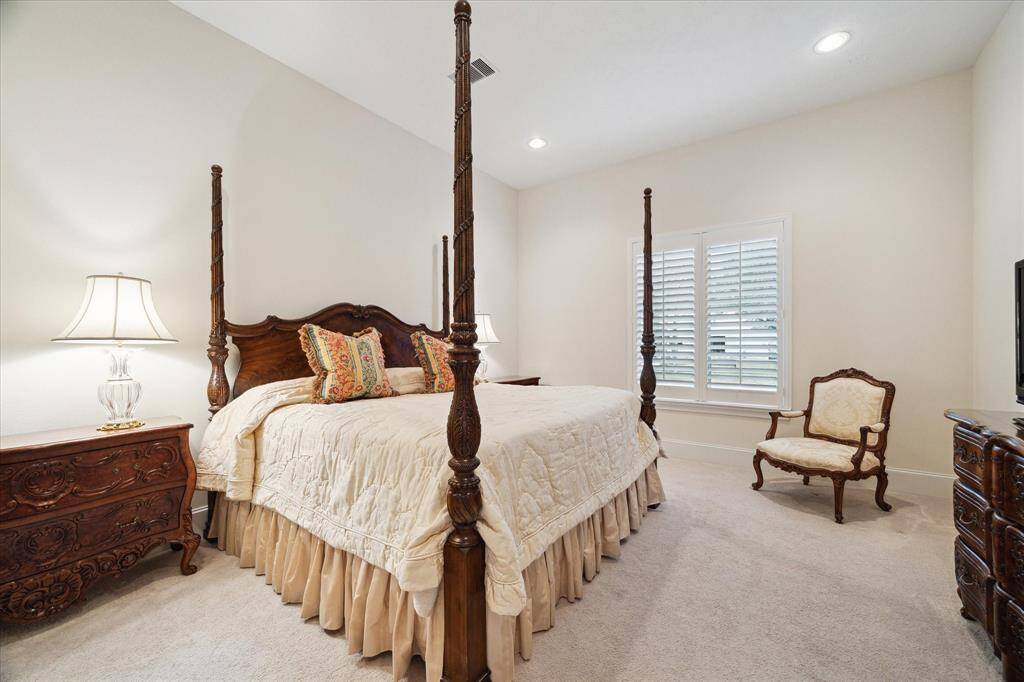 A great asset to the house - a downstairs GUEST BEDROOM (16 X 14) - just off the Living Room - including carpeted flooring, window with plantation shutters, base molding, painted walls, recessed lighting and En Suite Bath.