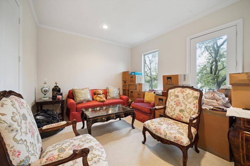 Second GUEST BEDROOM (14 X 12) includes carpeted flooring, recessed lighting, crown/base molding, window, glass front door to outdoor balcony (slate flooring, wrought iron railing), walk in closet with hanging compartments/shelving, En Suite Bath.